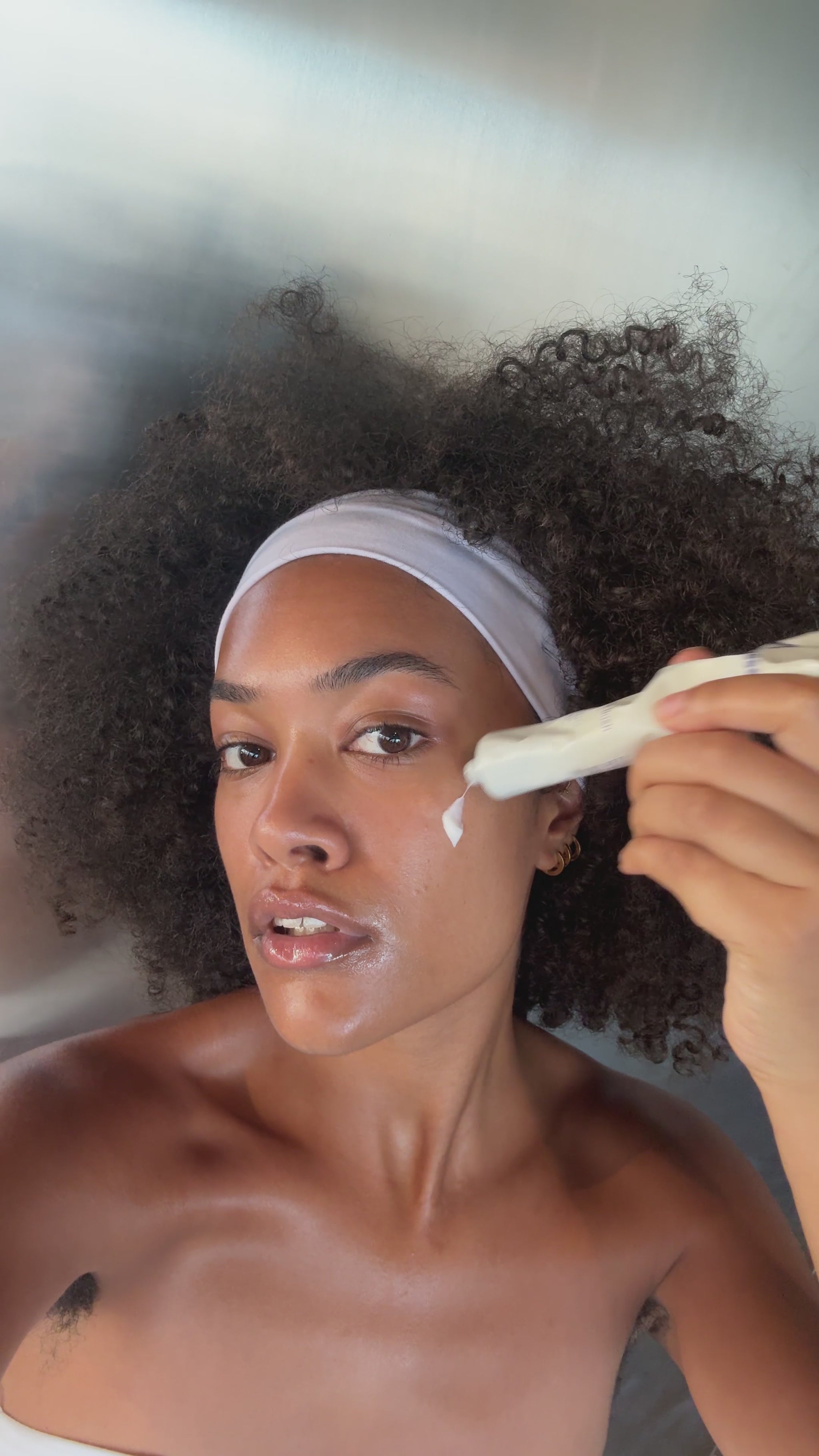 Moisture Rush Cream caption: Mia applies Moisture Rush Cream as part of her AM and PM routine. 